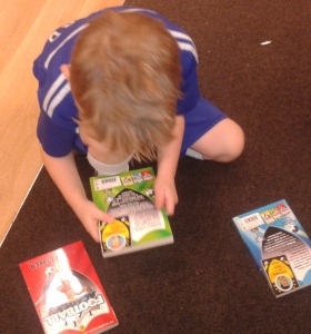 Eeny meeny miny mo: Toby decides which Football Academy book to pick. 